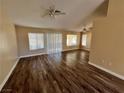 Spacious living room with wood-look floors and ceiling fan at 2505 Showcase Dr, Las Vegas, NV 89134