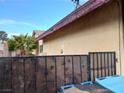 Rear house exterior view showing a portion of the house and a side yard at 4012 Mira Ln, Las Vegas, NV 89108