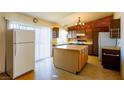 Kitchen features an island and brick accent wall at 404 Vassar Ln, Las Vegas, NV 89107