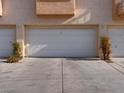 Attached garage with two parking spaces and exterior lighting at 5000 Red Rock St # 240, Las Vegas, NV 89118