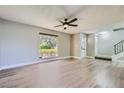 Light and airy living room with hardwood floors and ceiling fan at 618 Tam O Shanter, Las Vegas, NV 89109