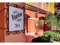 Luxury condo building with Spanish-style architecture, fountain, and ample parking at 30 Strada Di Villaggio # 227, Henderson, NV 89011