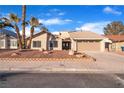 Single story home with two-car garage and landscaped yard at 6552 Barbary Cir, Las Vegas, NV 89103