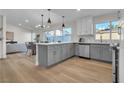 Modern gray kitchen with stainless steel appliances and island at 6552 Barbary Cir, Las Vegas, NV 89103