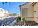 Landscaped walkway leading to the front entrance of the house at 7741 Orchard Wood Ct, Las Vegas, NV 89131