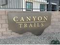 Canyon Trails community sign, modern bronze color with gold lettering at 9360 Serene Harbor St # Lot 32, Las Vegas, NV 89178