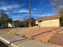 Single story home with carport and brick pathway at 5516 Gipsy Ave, Las Vegas, NV 89107