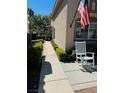 Sidewalk leading to the house entrance with a rocking chair at 7705 Sublimity Ave, Las Vegas, NV 89131