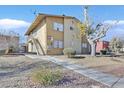 Two-story building with landscaping and parking at 3801 Daisy St # 40, Las Vegas, NV 89119