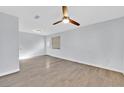 Bright living room with wood-look floors and ceiling fan at 3801 Daisy St # 40, Las Vegas, NV 89119