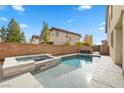 Inviting backyard with a sparkling pool and spa at 232 Punto Di Vista Dr, Henderson, NV 89011