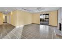 Living room with tile floors, fireplace and access to backyard at 5254 Wilbur St, Las Vegas, NV 89119