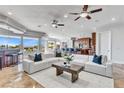 Spacious living room with sectional sofa and kitchen views at 73 Kittansett Loop, Henderson, NV 89052