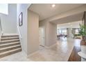 Staircase with carpet runner, view to dining area at 1918 Molly Brook Dr # Lot 5, North Las Vegas, NV 89084