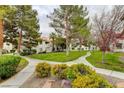 Landscaped grounds with walkways and lush greenery at 2645 S Durango Dr # 101, Las Vegas, NV 89117