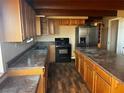 Spacious kitchen with wood cabinets and laminate countertops at 45 Camp Bonanza Rd, Las Vegas, NV 89124