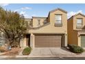 Two story house with brown garage door and landscaping at 9156 Mcginnis Ave, Las Vegas, NV 89148