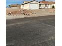 House exterior view, single-car garage, and a gravel front yard at 427 E Barrett St, Henderson, NV 89011