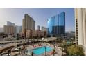 Daytime view of resort-style pool with city views at 135 E Harmon Ave # 407, Las Vegas, NV 89109