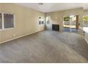 Spacious living room with fireplace and sliding glass doors at 256 Camelback Ridge Ave, Henderson, NV 89012