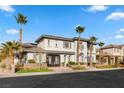 Stunning two-story home with palm trees and landscaped yard at 11664 Morning Grove Dr, Las Vegas, NV 89135