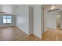 Bright bedroom featuring wood-look floors and a large window at 632 Tonin Ave, North Las Vegas, NV 89031