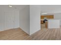 Light-filled entryway with wood-look floors and kitchen view at 632 Tonin Ave, North Las Vegas, NV 89031