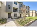 Attractive townhome exterior with manicured lawn at 12322 Dusk Blue Way # 2, Las Vegas, NV 89183