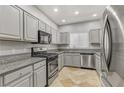 Modern kitchen with stainless steel appliances and granite countertops at 5250 S Rainbow Blvd # 2158, Las Vegas, NV 89118