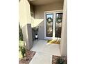 Inviting front entry with double doors and a welcome mat at 10478 Melodia Magico Ave, Las Vegas, NV 89135