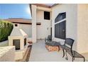 Outdoor patio space with a fireplace and comfortable seating at 363 Rushing Creek Ct, Henderson, NV 89014