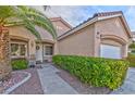 House exterior featuring walkway and lush green hedges at 10017 Snow Crest Pl, Las Vegas, NV 89134