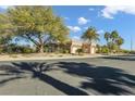 Single story house with a three-car garage, and mature landscaping at 10254 Sofferto Ave, Las Vegas, NV 89135