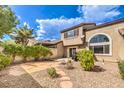 Landscaped backyard with patio and stone pathway at 10319 Birch Bluff Ln # 0, Las Vegas, NV 89145