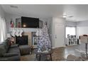 Cozy living room featuring a fireplace and Christmas tree at 4730 Double Down Dr # 102, Las Vegas, NV 89122