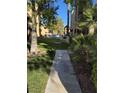 Landscaped pathway leads to a residential building at 5071 Pioneer Ave # 203, Las Vegas, NV 89146