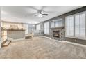 Spacious living room featuring a fireplace and plush carpeting at 10146 Robins Hollow Rd, Las Vegas, NV 89183