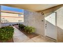 Inviting entryway with walkway, landscaping, and building exterior visible at 7300 Pirates Cove Rd # 1056, Las Vegas, NV 89145