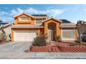 Two-story house with solar panels and attached garage at , North Las Vegas, NV 89031