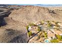 House nestled on hillside with desert landscape at 2168 Tiger Willow Dr, Henderson, NV 89012