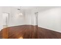 Bright dining room with hardwood floors and a crystal chandelier at 2777 Paradise Rd # 103, Las Vegas, NV 89109