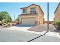 Two-story house with attached garage, desert landscaping, and a paved driveway at 3548 Lonesome Drum St, North Las Vegas, NV 89032