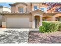 Two-story house with attached garage and manicured landscaping at 6031 Lamotte Ave, Las Vegas, NV 89141