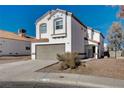 Two-story house with attached garage and landscaping at 8214 Mt Brodie Cir, Las Vegas, NV 89145