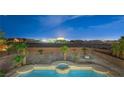 Stunning pool and spa with city views at night at 9795 La Cienega St, Las Vegas, NV 89183