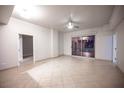 Bright living room with tile floors and sliding glass doors to balcony at 200 W Sahara Ave # 3607, Las Vegas, NV 89102