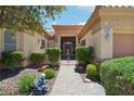 Landscaped front yard with a walkway to the front door at 7521 Apple Springs Ave, Las Vegas, NV 89131