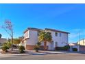 Two-story house with palm trees and desert landscaping, showcasing the side and back exterior at 9512 Canyonland Ct, Las Vegas, NV 89147