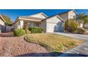 Charming one-story home with a two-car garage and neat landscaping at 9978 Coral Cameo Ct, Las Vegas, NV 89183