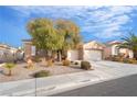 Attractive single-story home with a two-car garage and well-maintained landscaping at 2144 Paganini Ave, Henderson, NV 89052